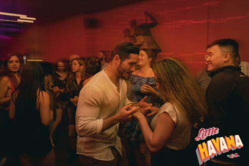 couple dancing bachata at dance event